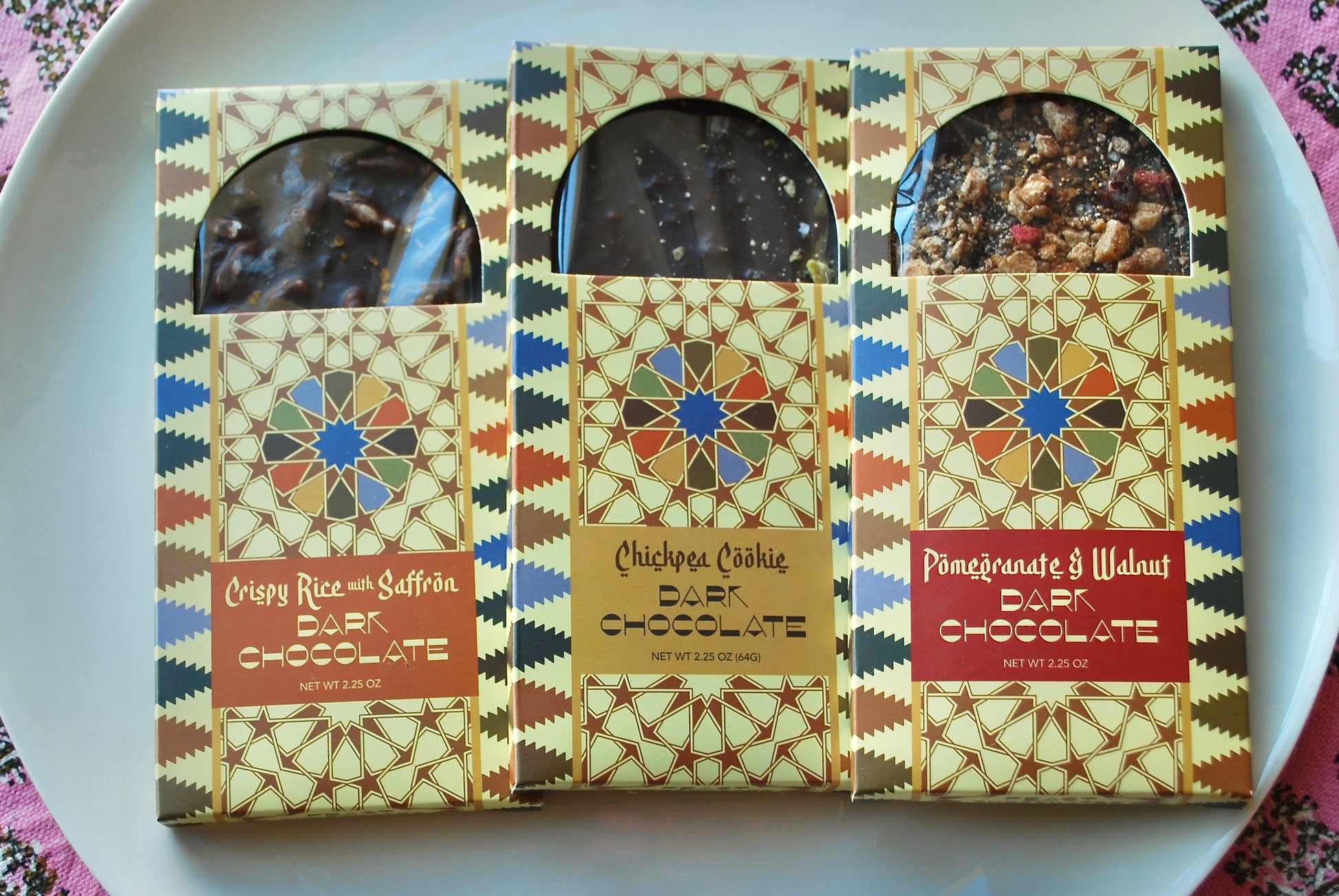 Variety of chocolate bars including Pomegranate & Walnut; Chickpea Cookie and Crispy Rice with Saffron