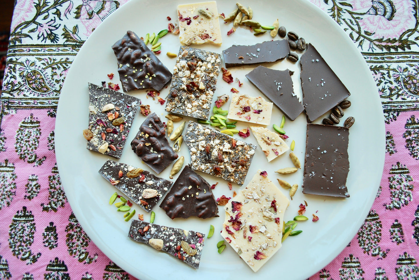 A variety of Persian Chocolate bars with pistachios, coffee and rose petals