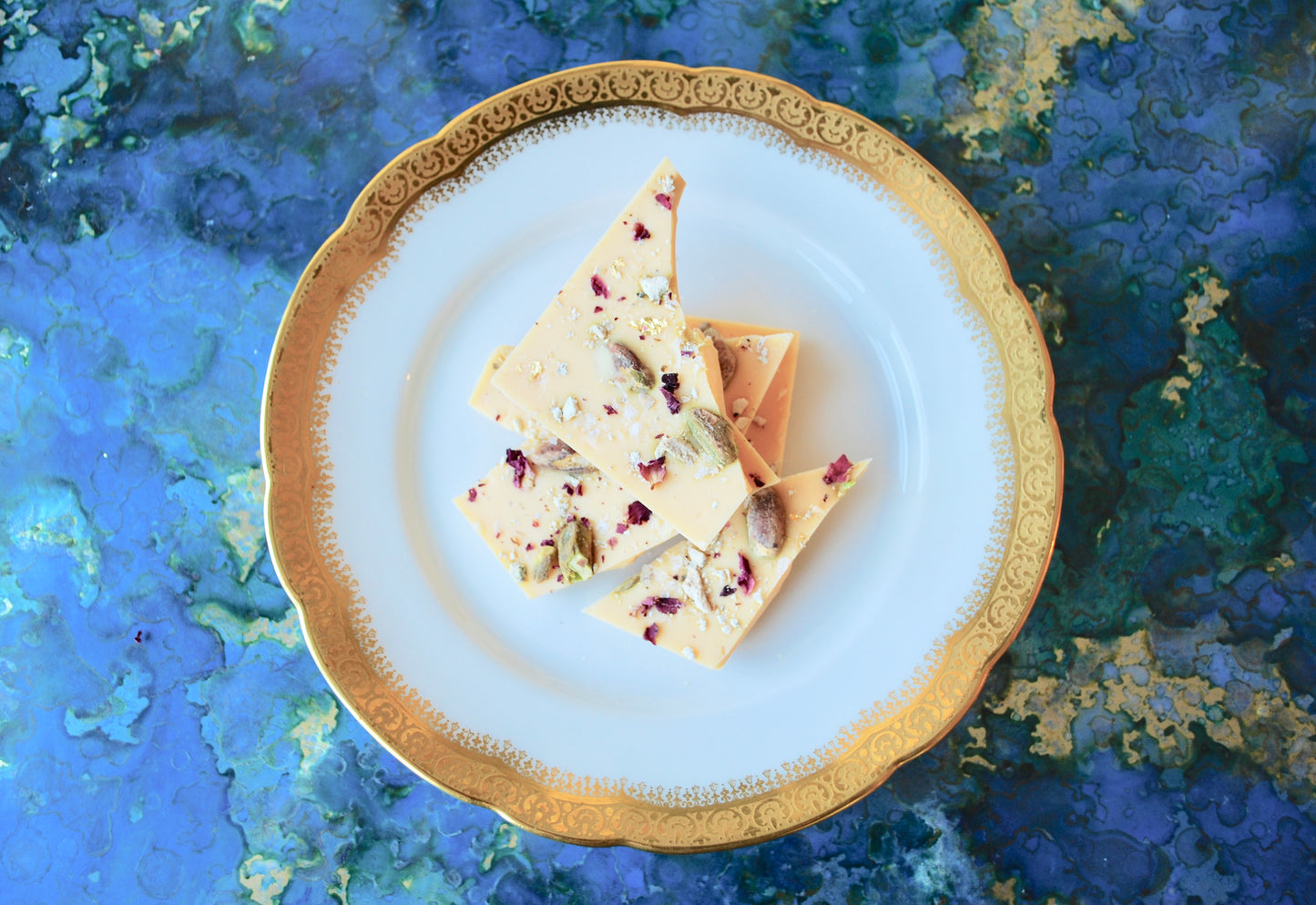 White Chocolate Persian Chocolate Bar on a plate with a blue background